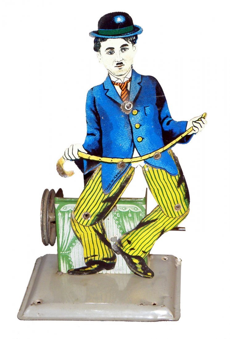 CHARLIE CHAPLIN SLATE DANCER: Tin litho toy by Wilhelm Krauss. Powered by either hand crank or steam. Light play wear. Size: 6-1/2" tall
