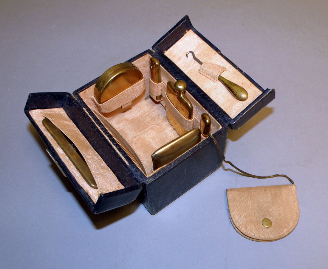 WWI ERA TOILETRY KIT: Comes in a leather valise with the initials H. R. H. embossed in gold on the top. Appears complete. Came from the Hayden Estate and probably belonged to Ray Hayden's wife. Some wear to leather case. S