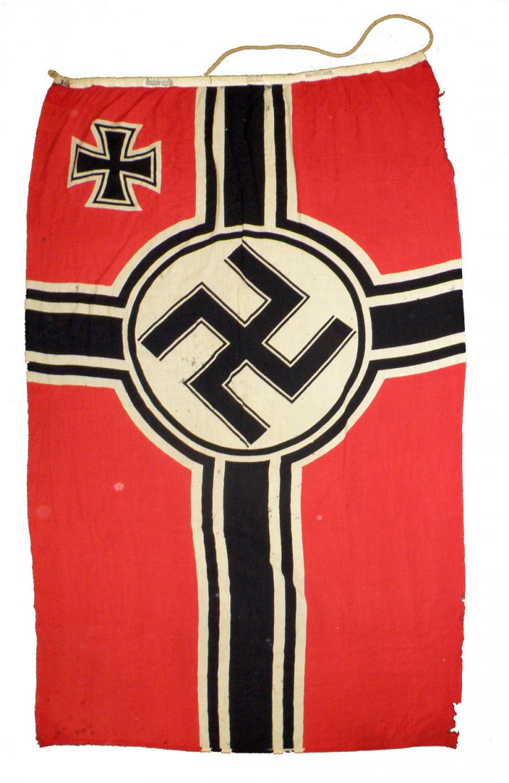 NAZI REICHKREIGS FLAG: German Battle Ensign, 1935-1945. Made of wool. Marked in fly, Plutzar & Brullkg. Has scattered damage and wear. Brought home by the consignor's father. Size: 59" x 98-5"