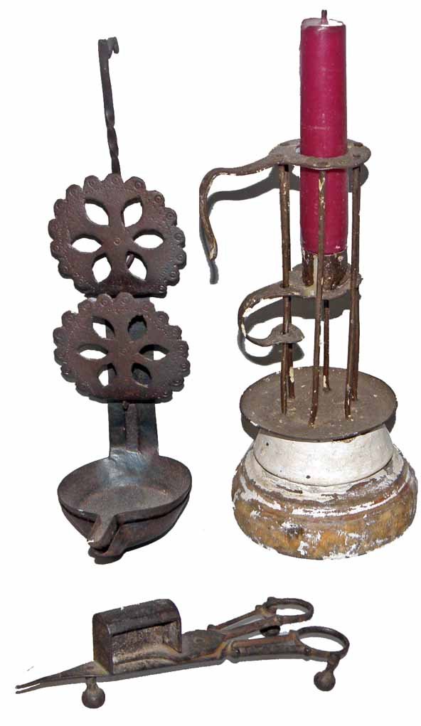 THREE EARLY LIGHTING ITEMS: Hand wrought iron betty lamp (hand punched decoration to "flowers"). Unusual handmade candle holder (wear to original paint). And a finely made wrought iron candle snuffer (probably early 19th century