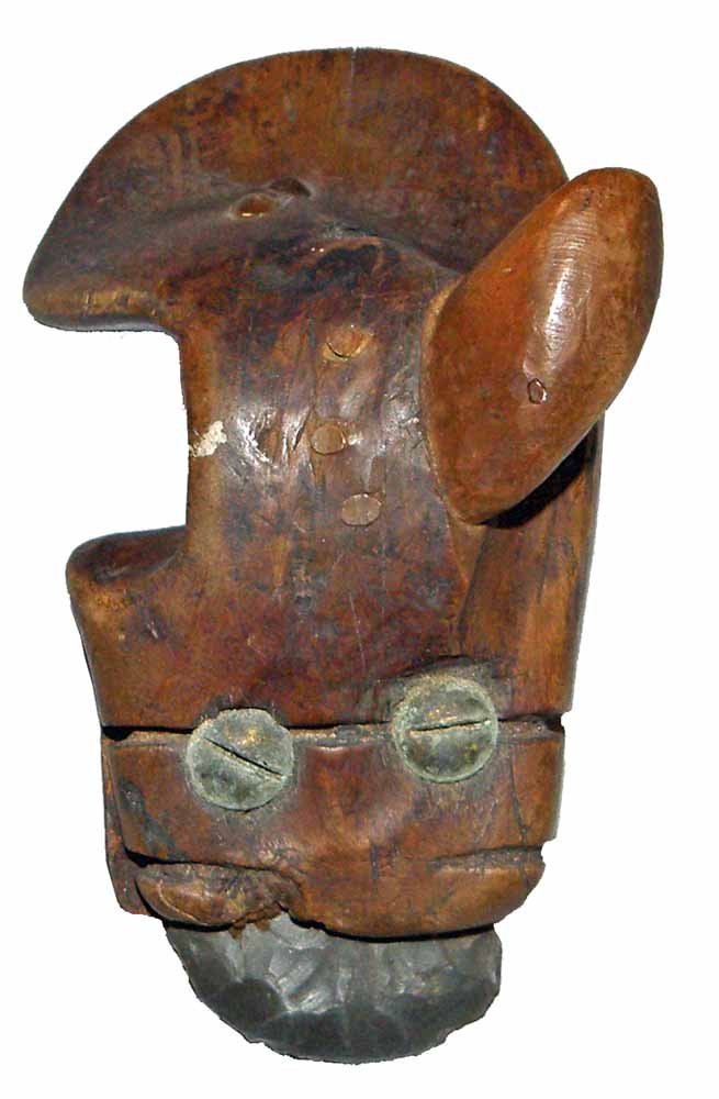 19TH CENTURY INUIT SCRAPER: Nicely carved molded scraper with added thumb guide that is held in place by wood pins. Flint stone retained by old brass screws and tin plate with cloth cushioning. Unusual form. Shows age and use we