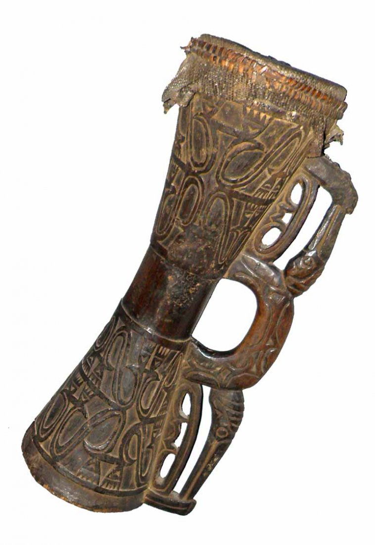 PAPUA NEW GUINEA ASMAT DRUM: Wonderfully carved with bird head handle. Original stretched lizard skin top with beeswax tuning knobs. Bottom handle has old split. Drum was collected in the village of Basim in 1973 by Magnus Anders