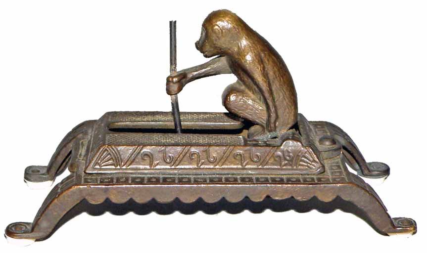 FIGURAL CAST BRASS MONKEY MECHANICAL MATCH HOLDER: Spring loaded monkey with spear. Very minor wear to patinated surface. Size: 6" long, 3" tall