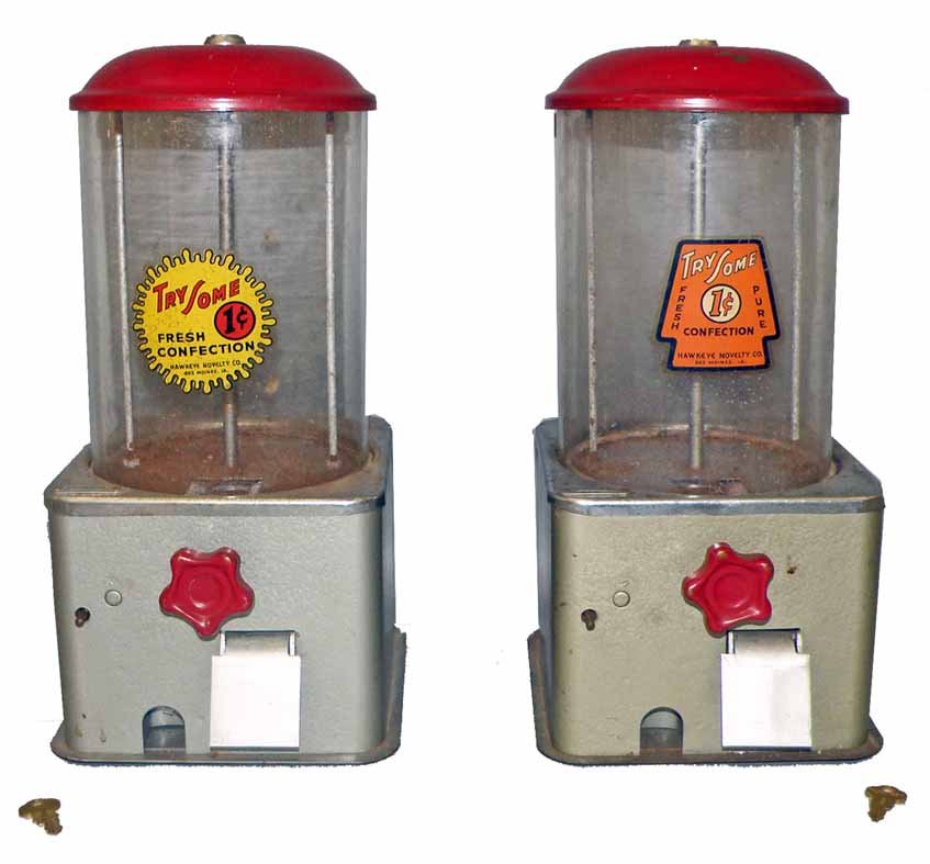 TWO HAWKEYE NOVELTY CANDY DISPENSERS: One cent vending machines with original decals and glass globes. Both have original keys. Some wear to plated cases. 15" tall