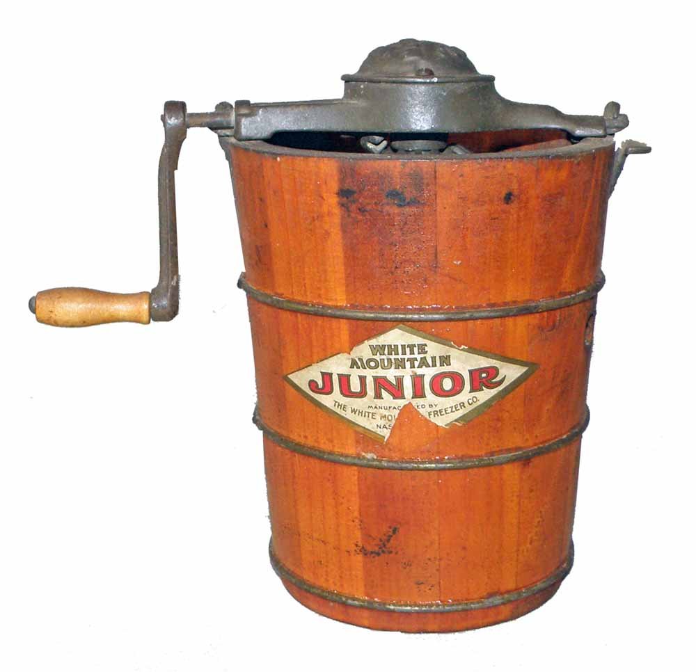 WHITE MOUNTAIN JUNIOR ICE CREAM FREEZER: Sample size ice cream maker. Some paper loss to label. 7 3/4" tall x 5" dia.