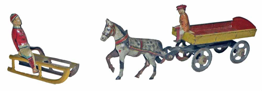 TWO PENNY TOYS: Boy on Sled and Horse and Dray Cart. Both have very minor wear. Largest 5 3/4" long