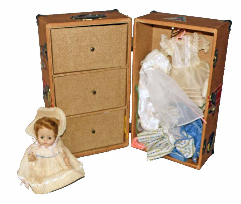 DOLL TRAVEL TRUNK WITH CLOTHING: 1930's paper on wood trunk by Mason & Parker. Some age and use wear. Loaded with various clothes. 14" tall