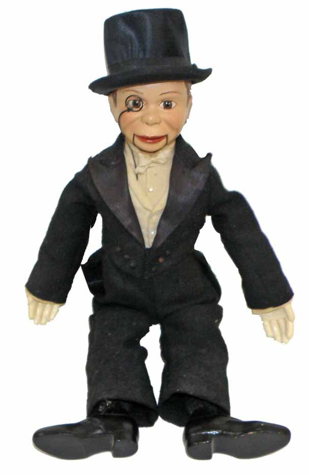CHARLIE McCARTHY VENTRILQUIST DOLL BY EFFANBEE: Cloth and composition doll wearing original tuxedo. Period, possibly original silk hat. Light wear and soiling to clothing. 20" tall