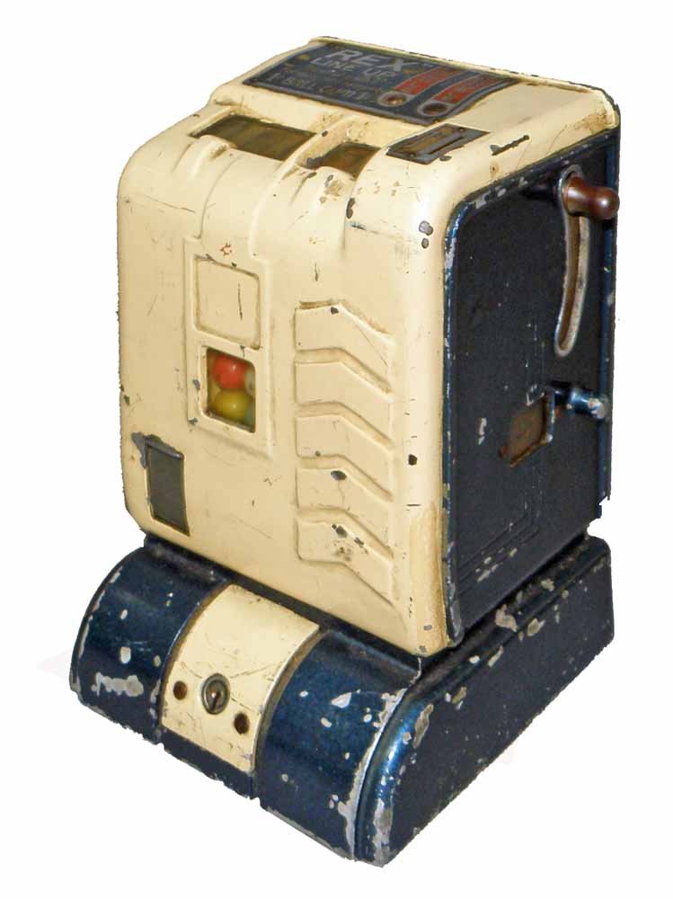 REX LINE UP TRADE STIMULATOR: Trade stimulator/gum vendor works fine. Retains original key. Scattered chipping to paint. 9" tall