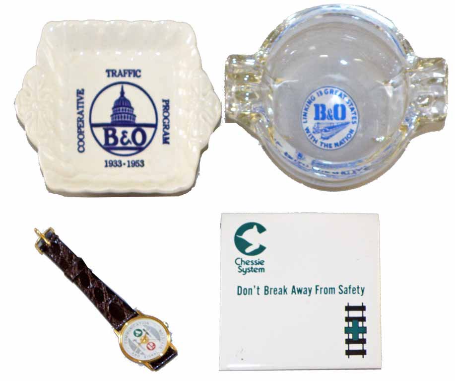 B & O AND CHESSIE ITEMS: Inhouse 1953 ashtray, a glass ashtray, a Chessie trivet and a Communication and Signal Division employee watch. Varies