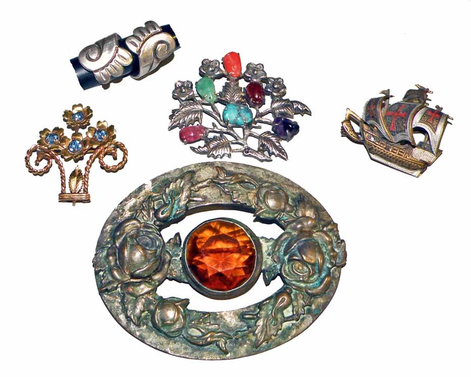 FIVE PIECES OF COSTUME JEWELRY: Includes; 12K GF flowery pot by Courtly, Taxco sterling ring, Mexican silver floral pin with semi precious stones, Spanish galleon marked Spain and a large Edwardian era brooch with cut glass stone an