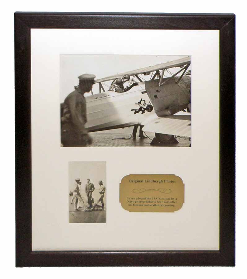 TWO ORIGINAL CHARLES LINDBERGH PHOTOS FRAMED: Taken aboard the USS Saratoga by a Navy photographer a few years after his Trans Atlantic Flight. Larger image shows him wearing flight helmet, climbing into a bi-plane with Felix the Cat insignia art