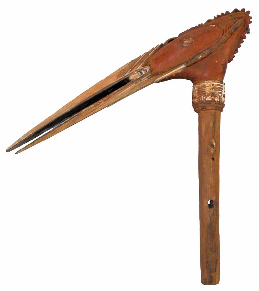 NEW GUINEA BIRD STAKE: Mid-20th Century carved wood. Nicely carved with remnants of red and white paint. 20-1/4" tall, 20-3/4" long