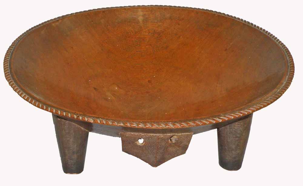 19th CENTURY FIJIAN KAVA BOWL: Beautifully carved from one piece of wood in traditional animal form. Beautifully carved rim. Provenance; Skinner. 20-1/4" diam., 6-1/8" tall