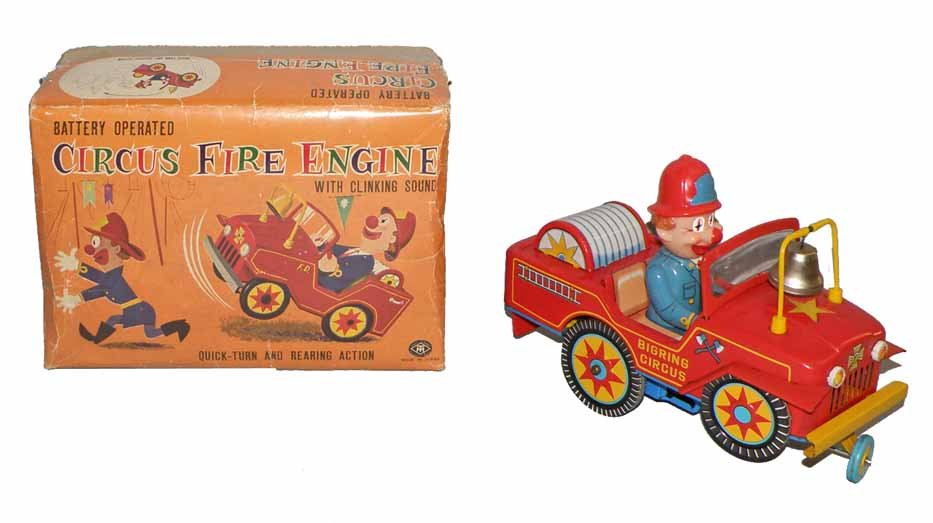 BOXED BATT-OP CIRCUS FIRE ENGINE: Tin toy with plastic clown head works fine. Made by Masudaya. Original box has some wear and creasing. Box grades very good. Toy has some light play wear. 11" long