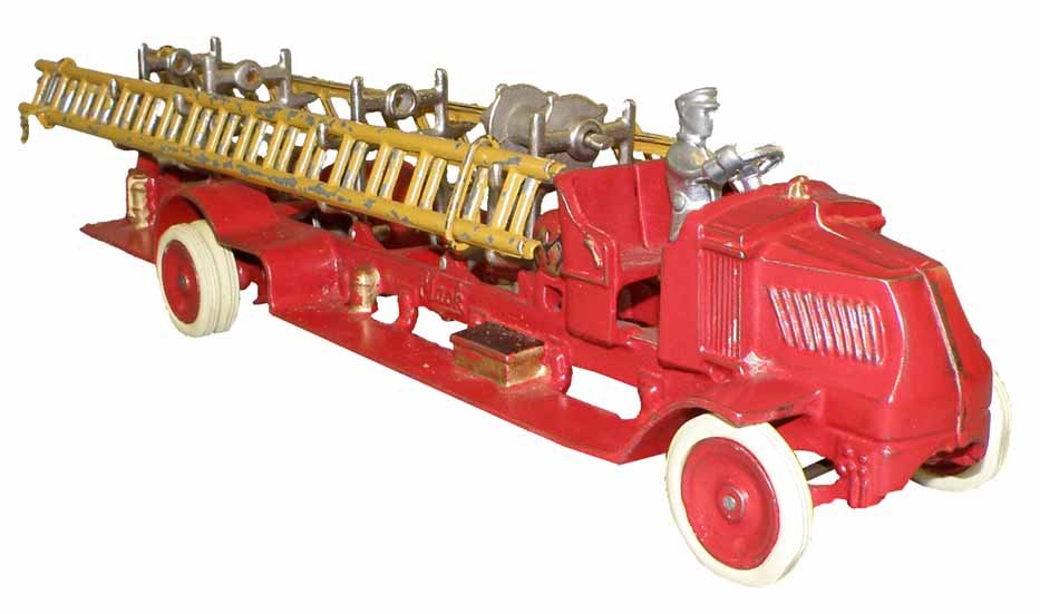ARCADE MACK FIRE LADDER TRUCK: Original paint. Cast iron truck has replaced driver, replaced tires and two replaced ladder racks. Retains original ladders, (some paint flaking). 17 1/2" long