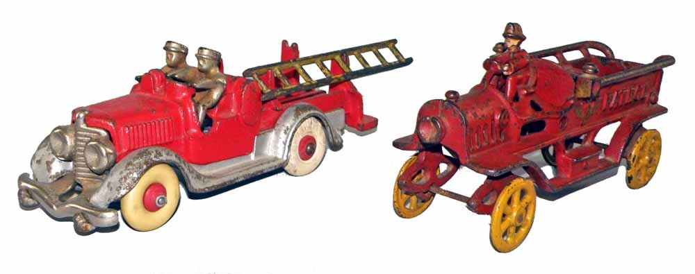 TWO CAST IRON FIRE TRUCKS: Ladder truck by Hubley retains one original ladder and original fireman. Front axle assembly replaced. Patrol wagon by Kenton Hardware is missing fireman from back compartment. Scattered paint wear to