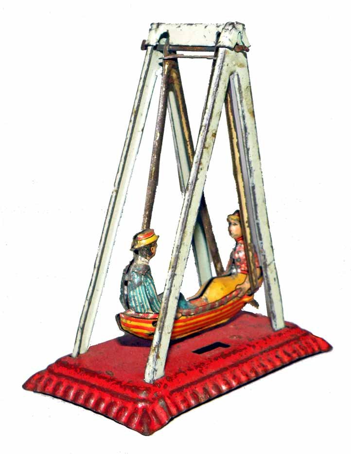 PENNY TOY SWINGING BOAT BY MEIER: Some spotting to base and stanchions. 2-3/4" long, 3-1/4 tall