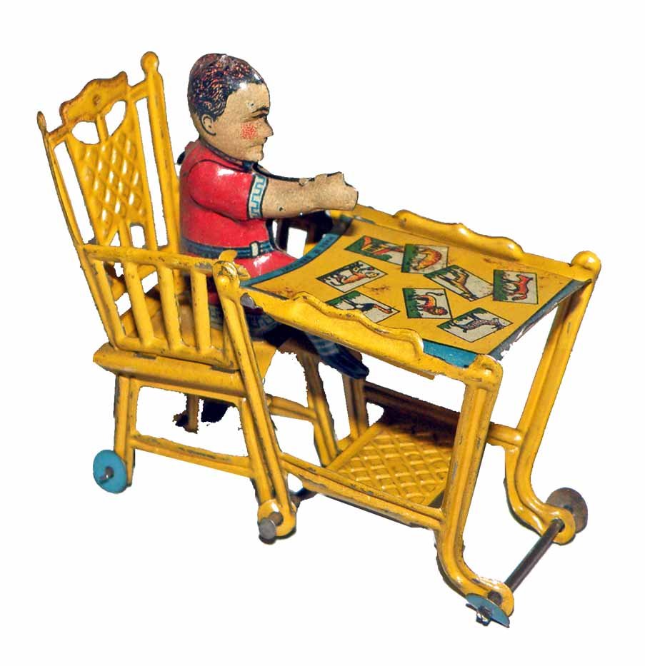 PENNY TOY CHILD IN CONVERTIBLE HIGH CHAIR: Converts from high chair to feeding chair. Minor wear. 4-1/4"