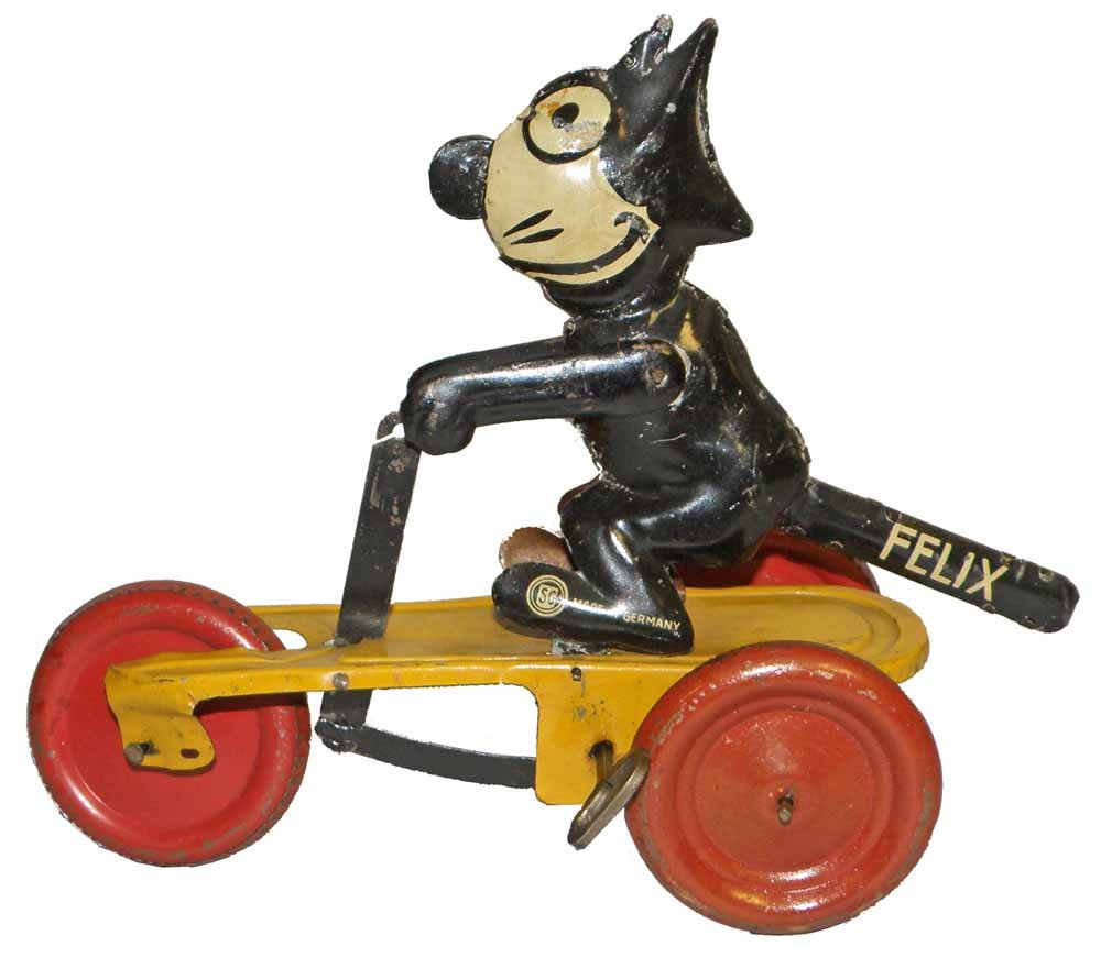 GUNTHERMANN FELIX THE CAT CART: Tin litho toy works fine. Scattered minor scratching. 8" long, 6-1/4" tall