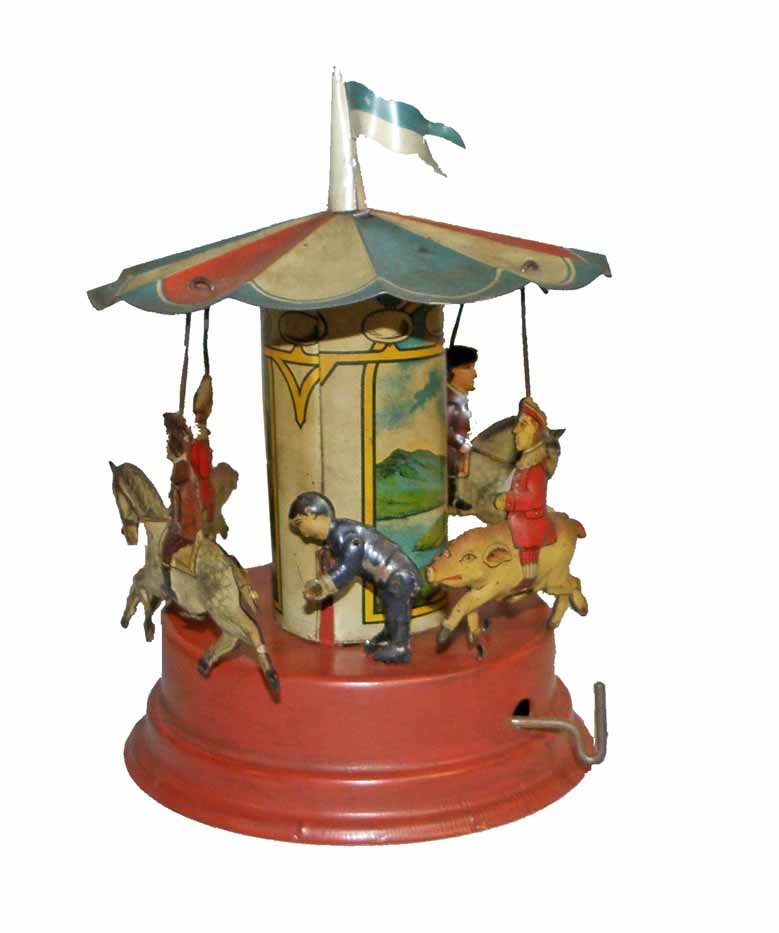 GUNTHERMANN MERRY GO ROUND: Working tin toy with plink plink mechanism. Minor wear and soiling. 7" tall