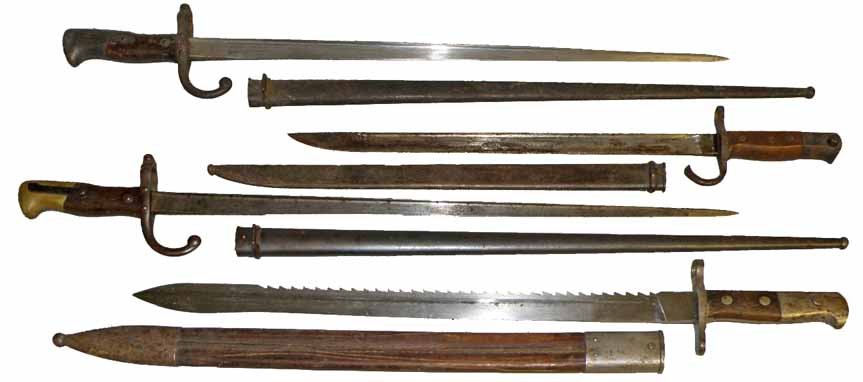 FOUR 19TH CENTURY BAYONETS: All with original Scabbards. Two French sword bayonets 1876. 1900 French sword bayonet. German Waffenfabrik sword bayonet. Size and condition Varies. Varies