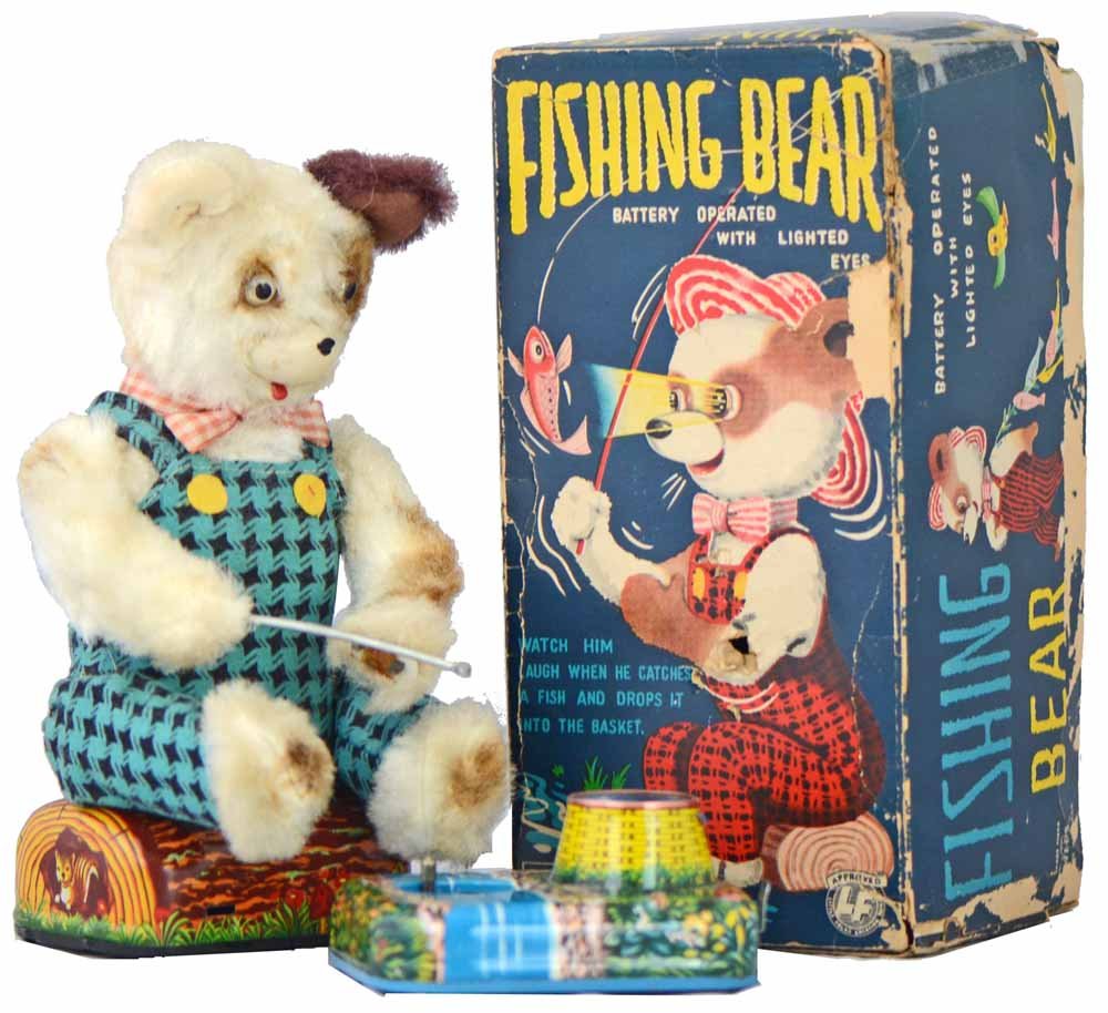 BOXED BATTERY OPERATED FISHING BEAR: Working toy by Alps. Comes with one original tin fish. Box lid has wear and damage. Toy shows play wear and soiling to clothing. Box - Good.9 1/2" Tall
