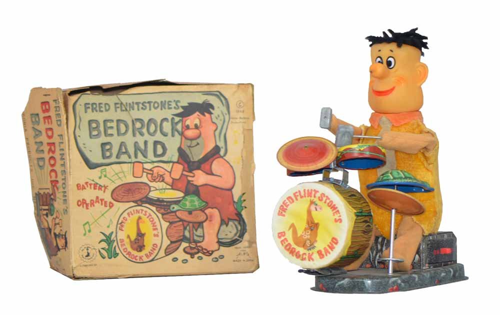 BOXED FRED FLINSTONE BEDROCK BAND: Works fine. Original box shows wear and damage. Box - Good. Toy has minor wear and repair to front of bass drum.9" Tall