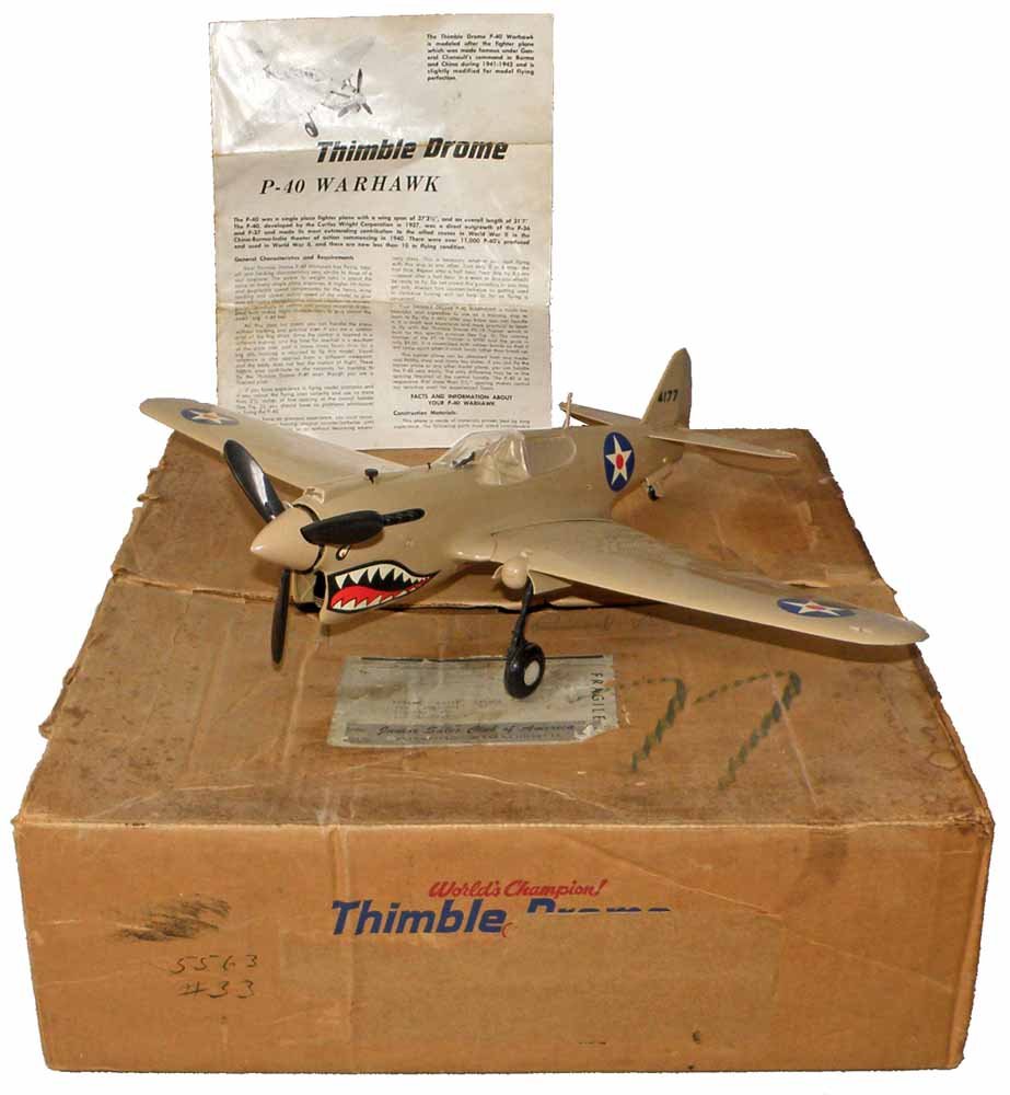 BOXED THIMBLE-DROME P40: Complete and never flown Cox toy. Box has label from Junior Sales Club of America. Box complete - VF.15" Long 20" Wide