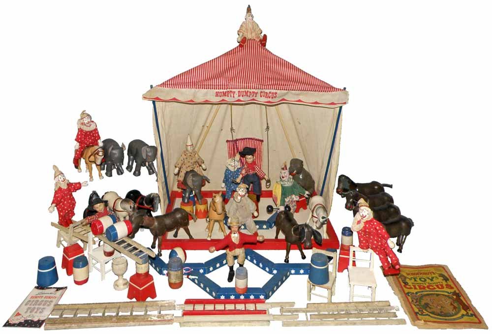 LARGE GROUP OF SCHOENHUT HUMPTY DUMPTY CIRCUS PIECES: Mixture of older pieces from Humpty Dumpty Toys, Inc. Includes; tent, 8 clowns, Ring master, 2 hobos, 4 elephants, 6 donkeys, 4 horses, chairs, ladders, stands, etc.Varies