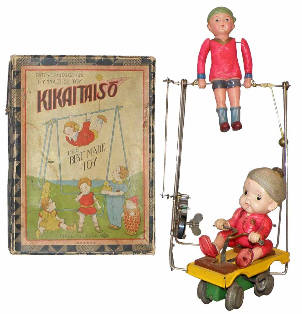 TWO PRE WAR JAPANESE TOYS: Boxed Kikaitaiso by Kuromachi and a boy on Irish mail. Irish male figure has dent to head. Both toys work fine. Box condition - VG.Largest 9 1/2" Tall