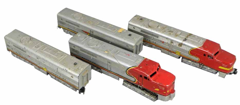 TWO AMERICAN FLYER SANTA FE ENGINES: Both show wear and touch up. One engine damaged and repaired. Not tested.12 1/2" Long