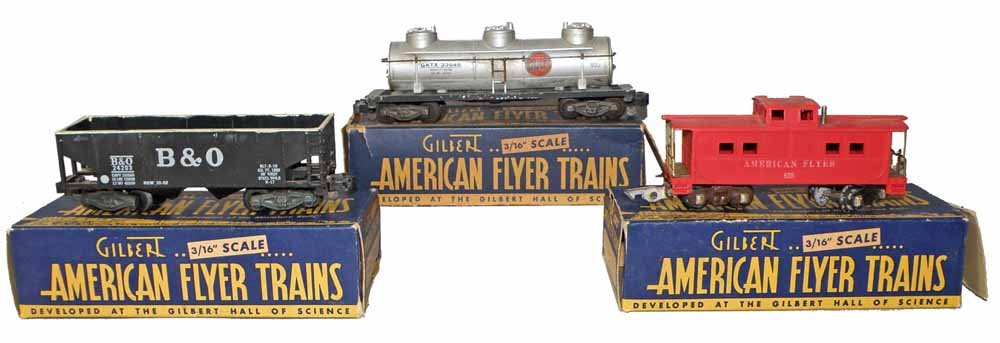 THREE BOXED AMERICAN FLYER TRAIN CARS: #24203 Coal Car, #638 Caboose, #926 Tanker Car in incorrect box, complete boxes show wear and damage, boxes grade Good to Very Good, cars show some wear and soiling.Largest 9'' Long