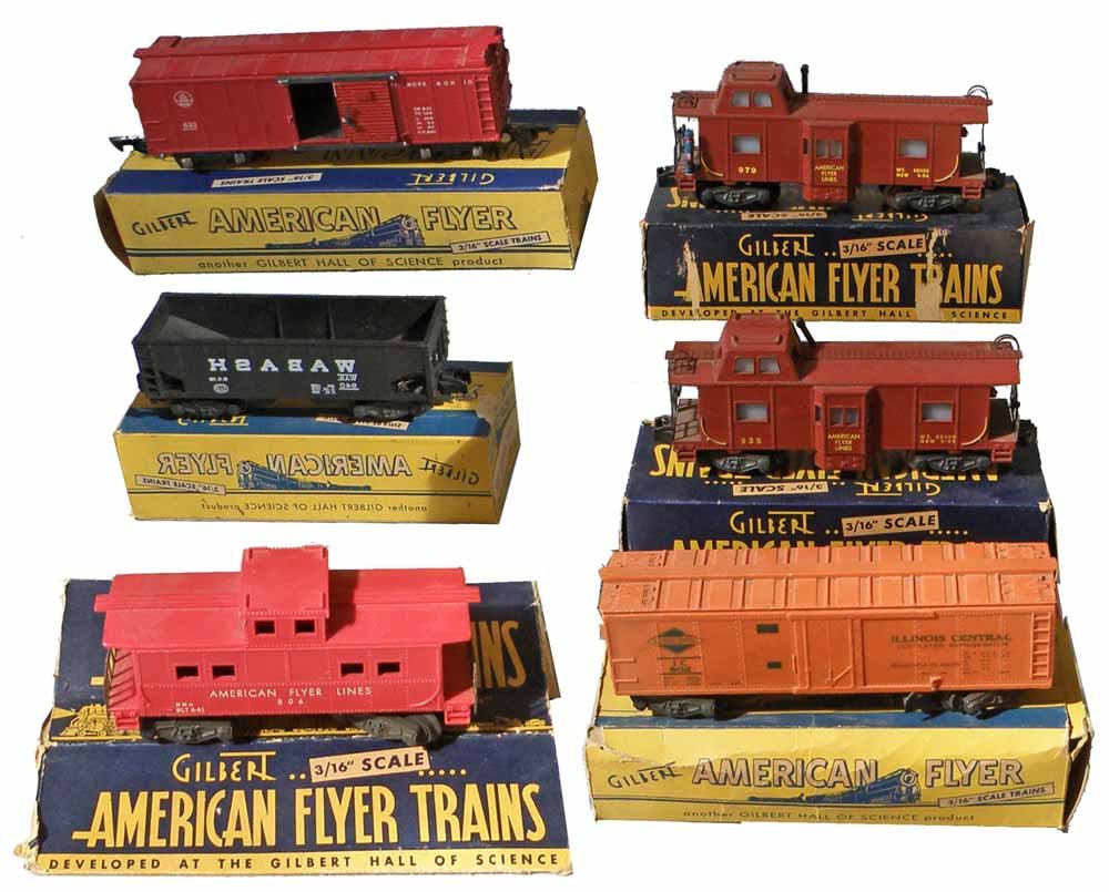 SIX BOXED AMERICAN FLYER TRAIN CARS: #940 Coal Car, #806 Caboose, #25031 Action Caboose, #633 B&O Freight Car, #935 Caboose, and a #802 Refrigerator Car. All boxes incomplete and show wear. Boxes grade Fair to Good. Some cars show play w