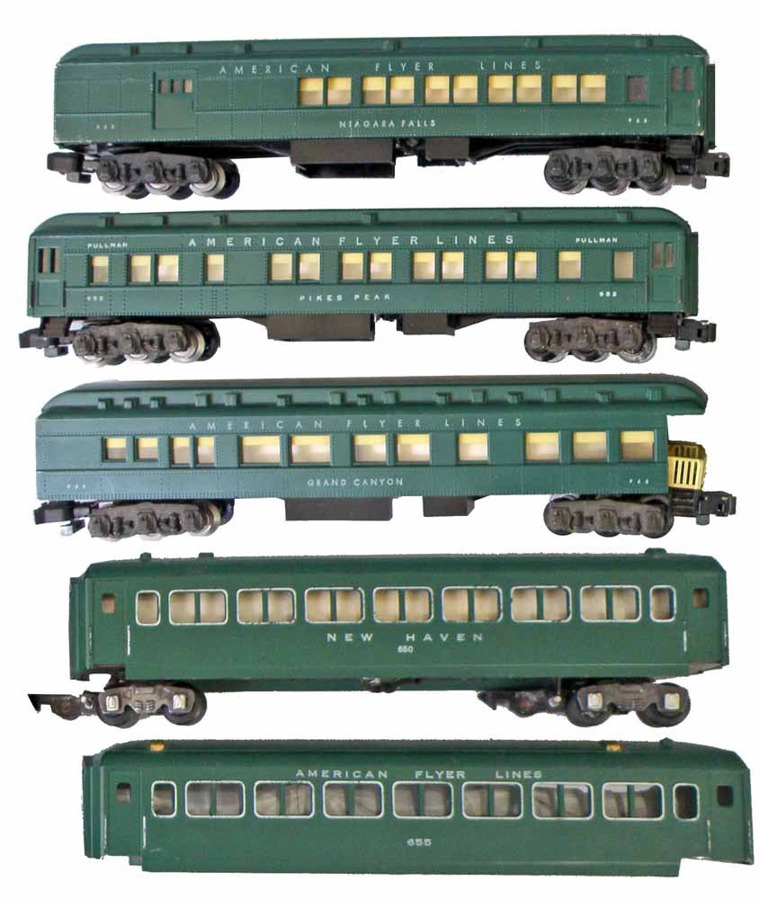 FIVE AMERICAN FLYER RAILROAD PASSENGER CARS: #954 Grand Canyon Observation Car, #953 Niagara Falls Car, #952 Pikes Peak Car, #650 New Haven Car, #655 Passenger Body, some play wear.Largest 12 1/2'' Long
