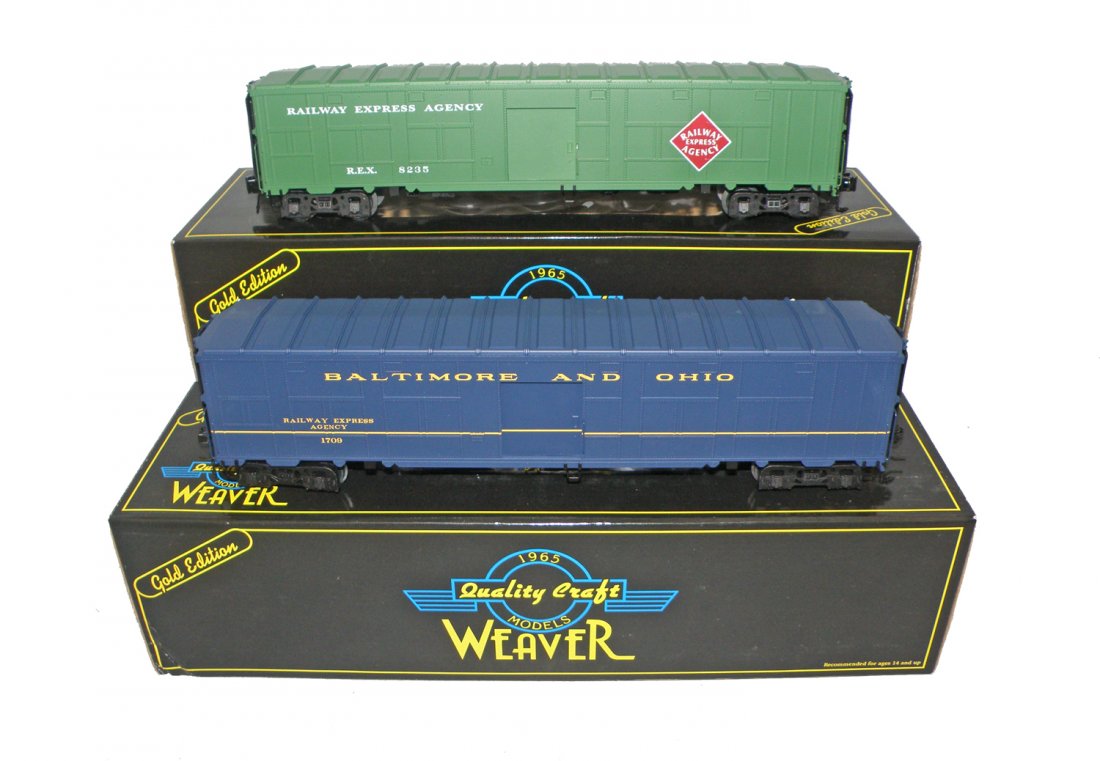 TWO BOXED WEAVER FREIGHT CARS: World War II Troop Train, B&O express car, and REA express car. Size: 14 1/2" long