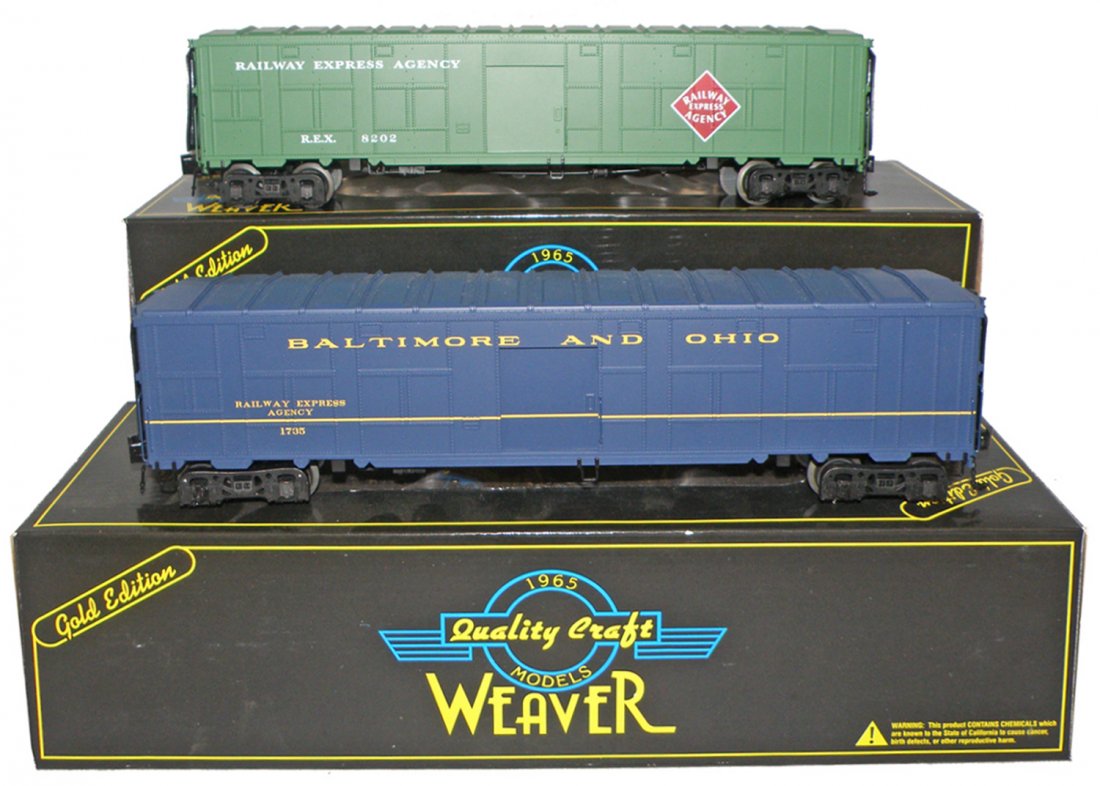 TWO BOXED WEAVER FREIGHT CARS: World War II Troop Train, B&O express car and REA express car. Size: 14 1/2" long
