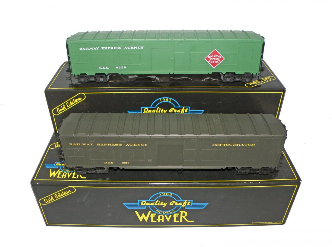 TWO BOXED WEAVER FREIGHT CARS: World War II Troop Train, REA reefer car and REA express car. Size: 14 1/2" long