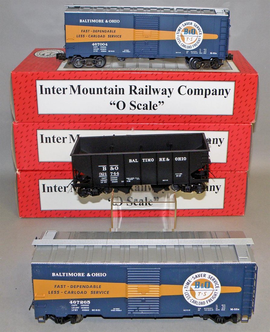 THREE BOXED INTERMOUNTAIN RAILWAY B&O FREIGHT CARS: Unused O Scale, two #25146 box cars and a #25401s two bay hopper. Size: largest 11" long