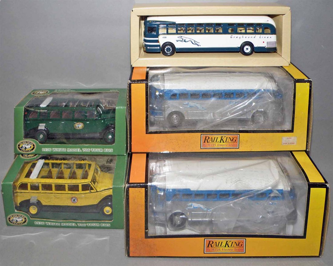FIVE BOXED DIE CAST BUSES: Two boxed Greyhound by Rail King, two boxed white buses, and Corgi Greyhound. Size: largest 8 1/4" long