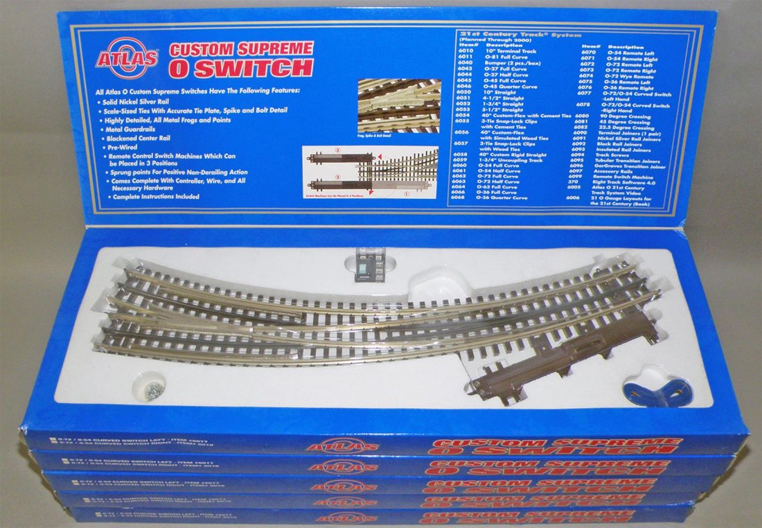 FIVE BOXES OF ATLAS CUSTOM SUPREME O SWITCH: Unused O Scale #6077 curved switch left. Size: 22" long