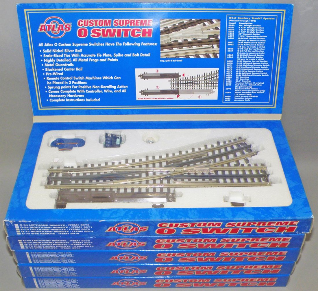 FIVE BOXES OF ATLAS CUSTOM SUPREME O SWITCH: Unused O Scale, three # 6070 left hand remotes, #6072 left hand remote and #6074 Wye remote. Size: 15" long