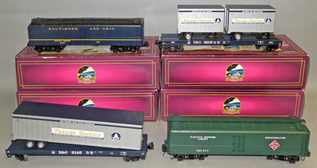 FOUR BOXED MTH FREIGHT CARS: Unused O Scale, #20-94075 REA Reefer car, #20-94116 B&O Reefer car, #20-98115 B&O Flat car, #20-90026d B&O Flat car. Size: largest 14" long