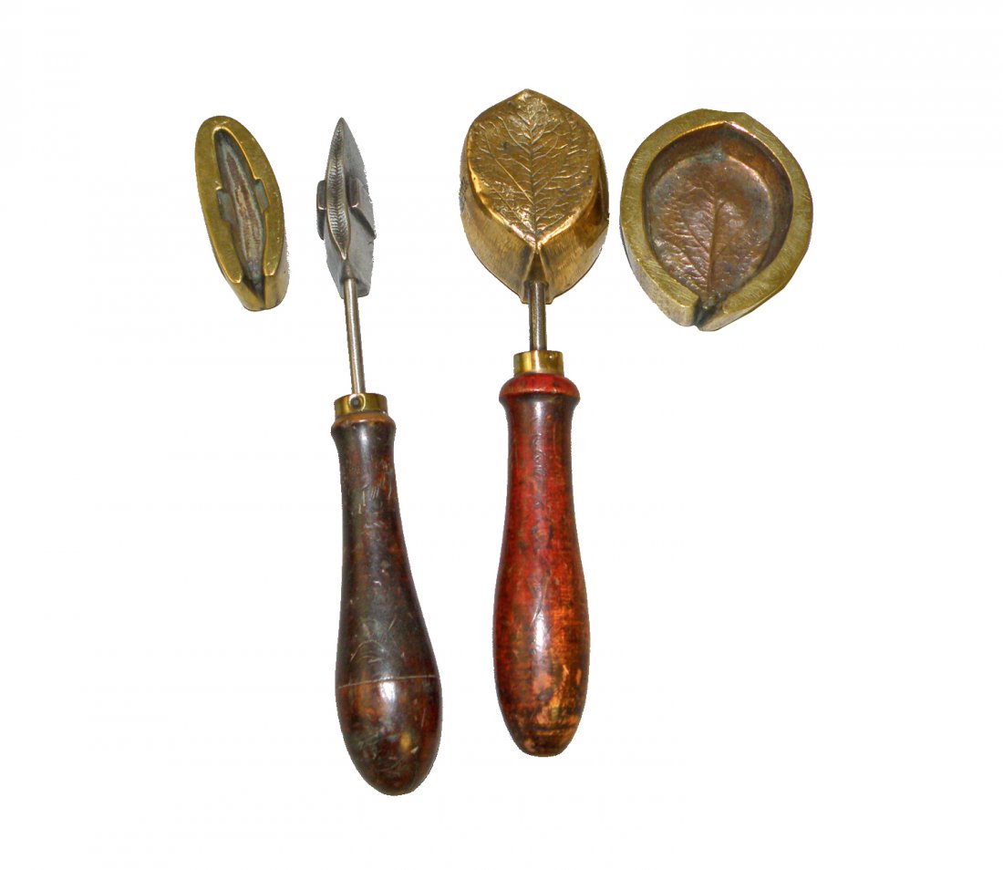 TWO PIECE BRASS STEEL AND WOOD MOLDS FOR MAKING LEAFS: Probably for a jeweler to hammer silver or gold leaf. One marked 1690.The other mold is marked D.Armand 19 Rue Des Gravillier, Paris. 8" long