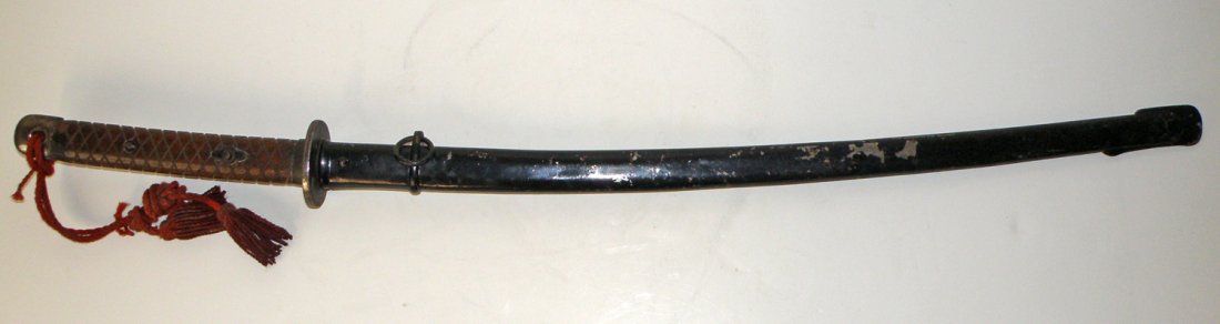 JAPANESE WWII NCO SWORD: NCO sword with original scabbard. Matching serial numbers to both 205663. Plain iron tsuba. All original. Sword possibly original. Blade length - 27 3/4" long overall 38" long