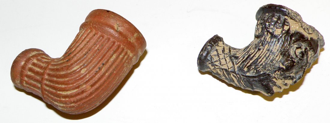 TWO ANTIQUE PIPE BOWLS: Red clay and unusual figural lead excavated bowl. largest 1 1/2"