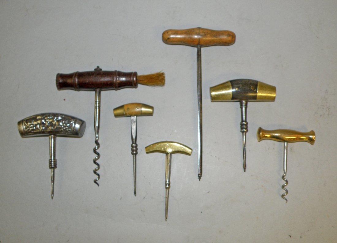 LOT OF ANTIQUE CORK SCREWS: Seven wine related pieces. Wood, iron and brass. Interesting grouping. largest 7 1/4" long