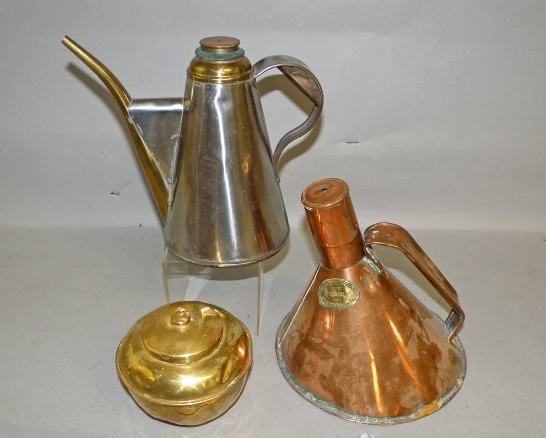 THREE ANTIQUE BRASS AND COPPER CONTAINERS: Brass Blood's whistling kettle. A one liter pourer marked Henry Hamelle and a copper Lipton tea caddy. Some denting to caddy. largest 8" tall