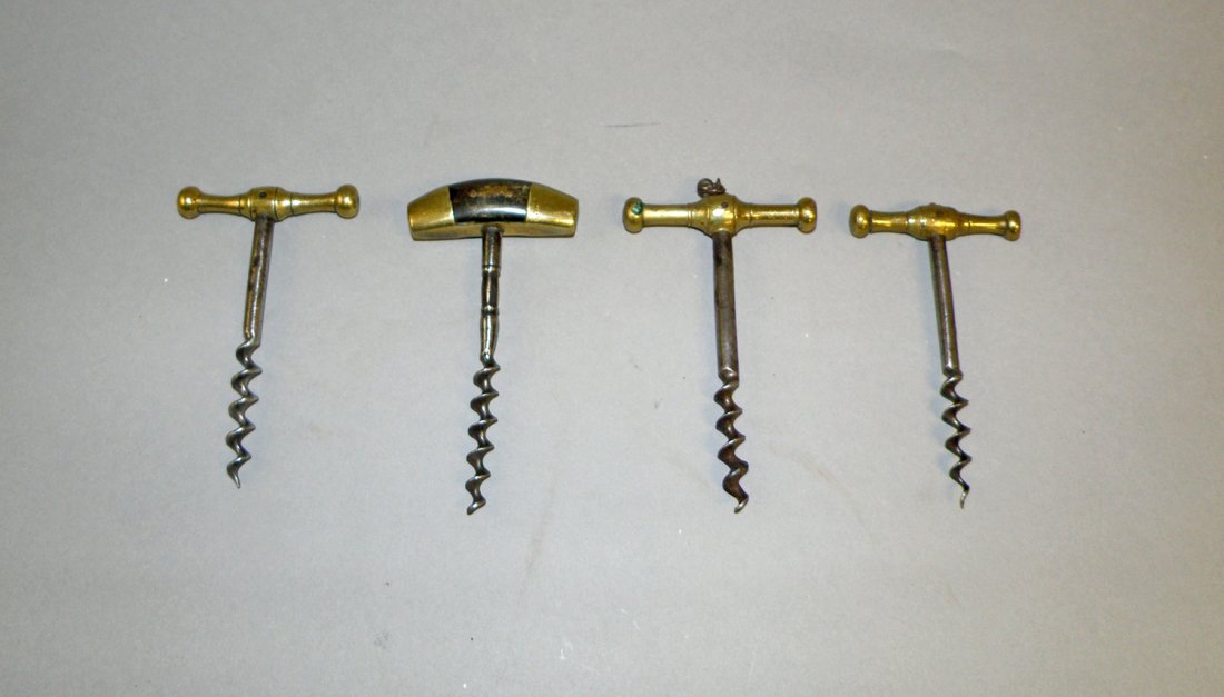 FOUR ANTIQUE CORK SCREWS: Wood brass and steel. All with T-handles. largest 4 7/8" long