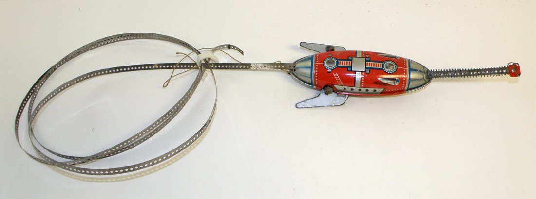 GUNTHERMANN SPACE ROCKET: Made in US zone Germany and retains track, missing parachutist. Some scratching, works fine 7 1/8" long